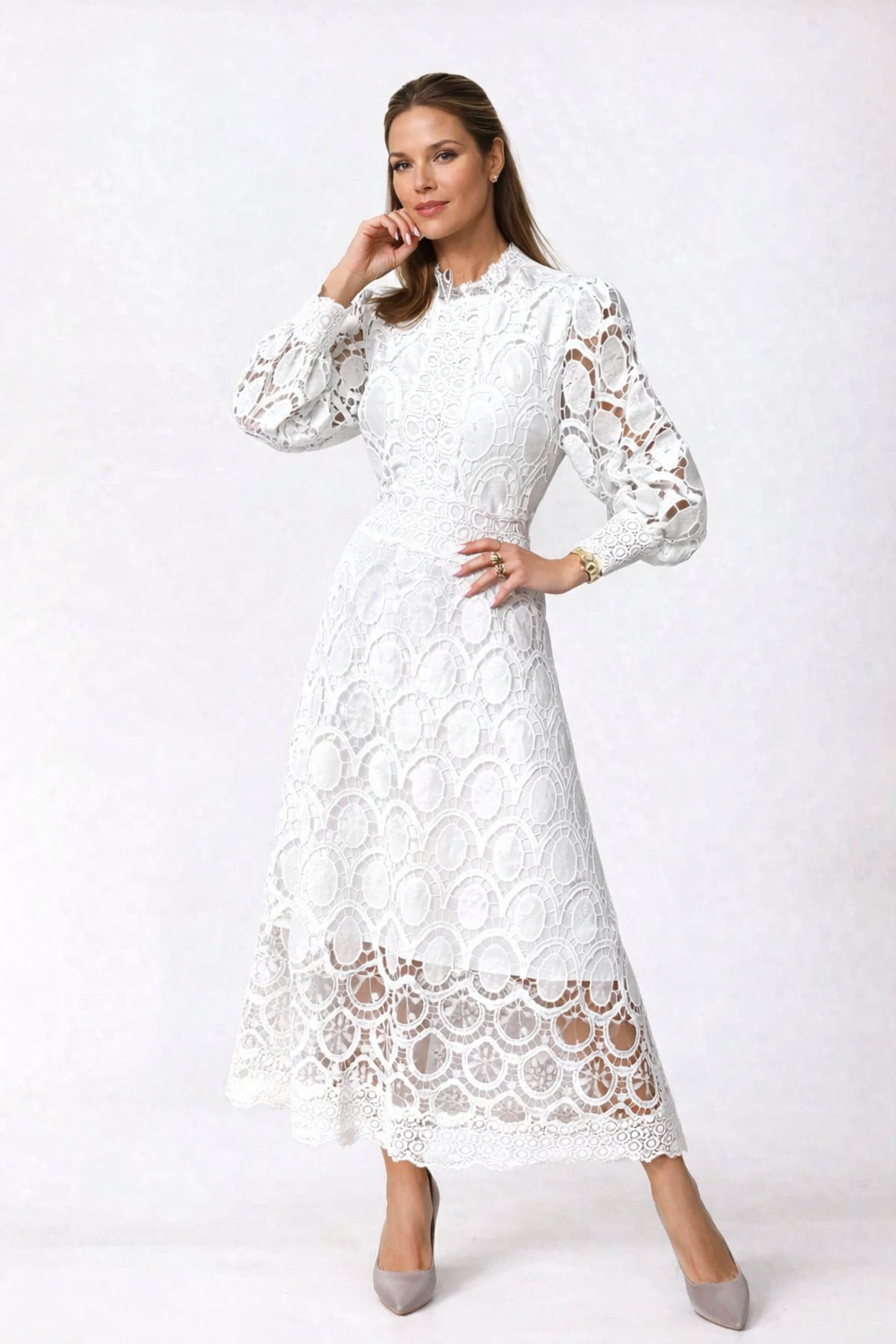Woman wearing a white lace dress on a white background