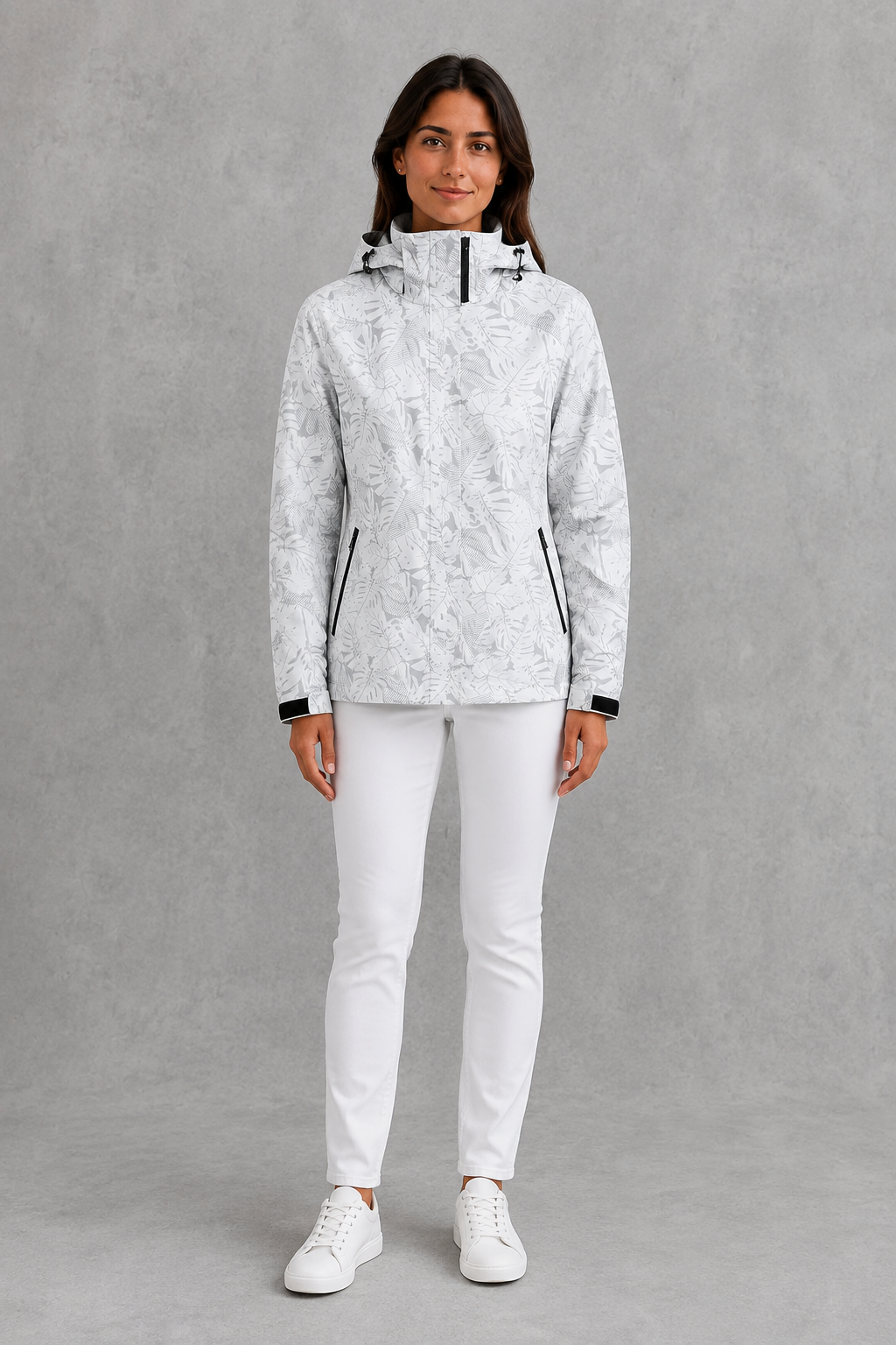 Women’s leaf print hooded rain jacket with a botanical pattern, adjustable drawstring waist and lightweight waterproof, windproof construction.