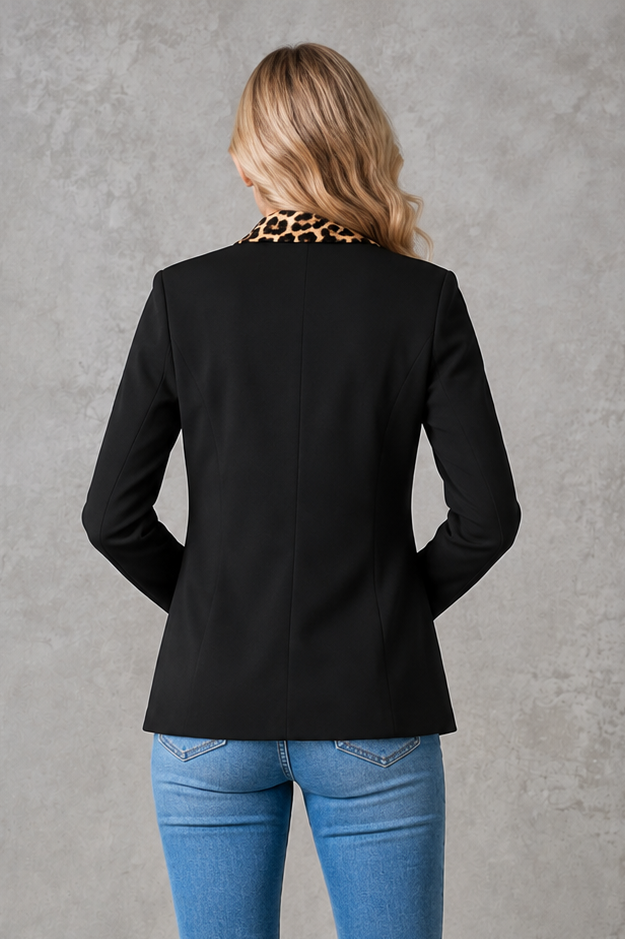 Women’s open-front tailored blazer with leopard print lapel and pocket trim, classic notched collar, functional flap pockets, and a hip-length silhouette.