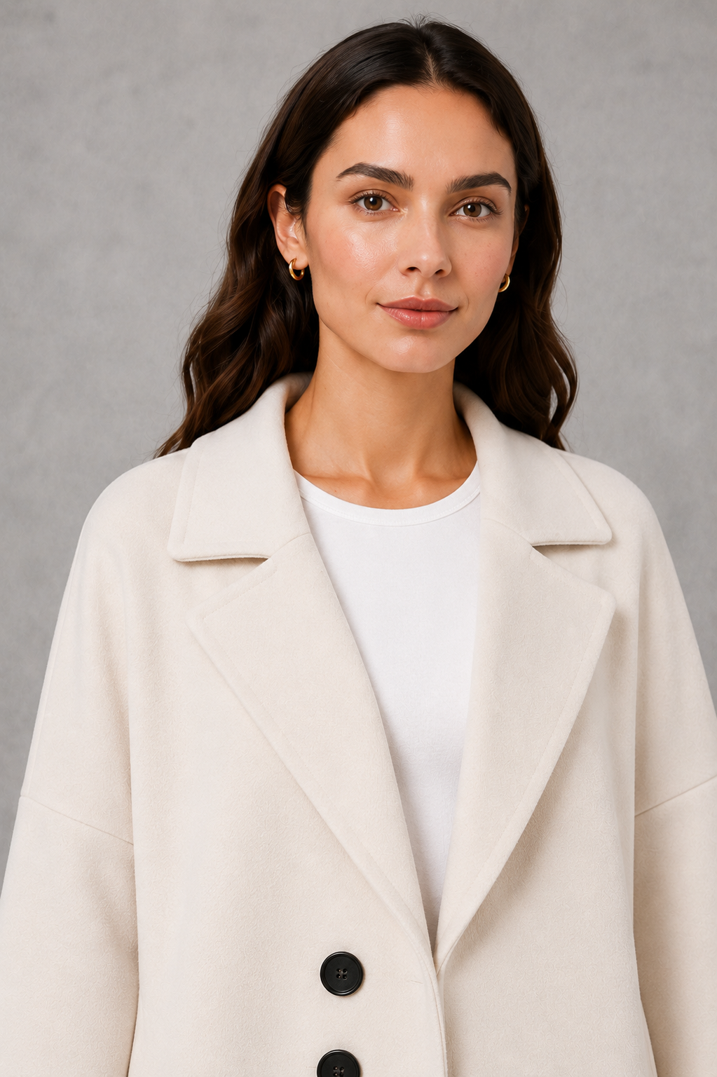 Women’s lightweight longline coat with a soft-touch finish and elegant streamlined silhouette for polished transitional layering.