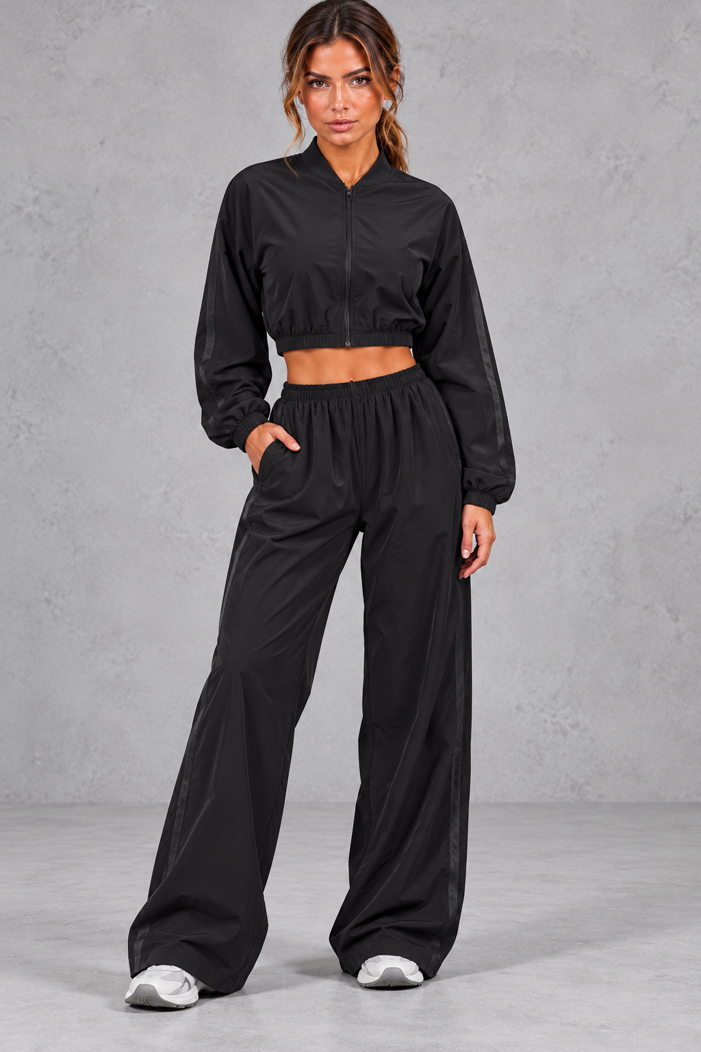 Women's cropped zip-up jacket and wide leg pants activewear set, front view