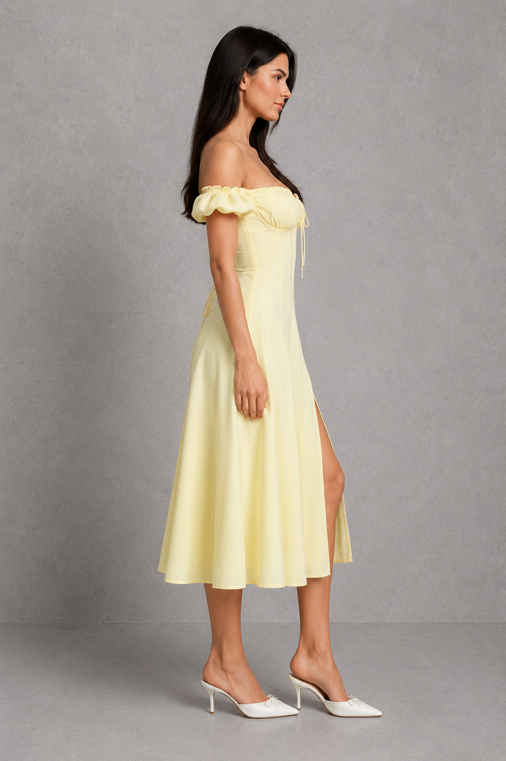 Elegant milkmaid midi dress in a premium cotton blend featuring a structured corset bodice with boning, underwired bust, elasticated puff sleeves, a flowing full skirt, and a thigh-high split. Designed with a shirred lace-up back for a flattering, feminine silhouette perfect for special occasions.