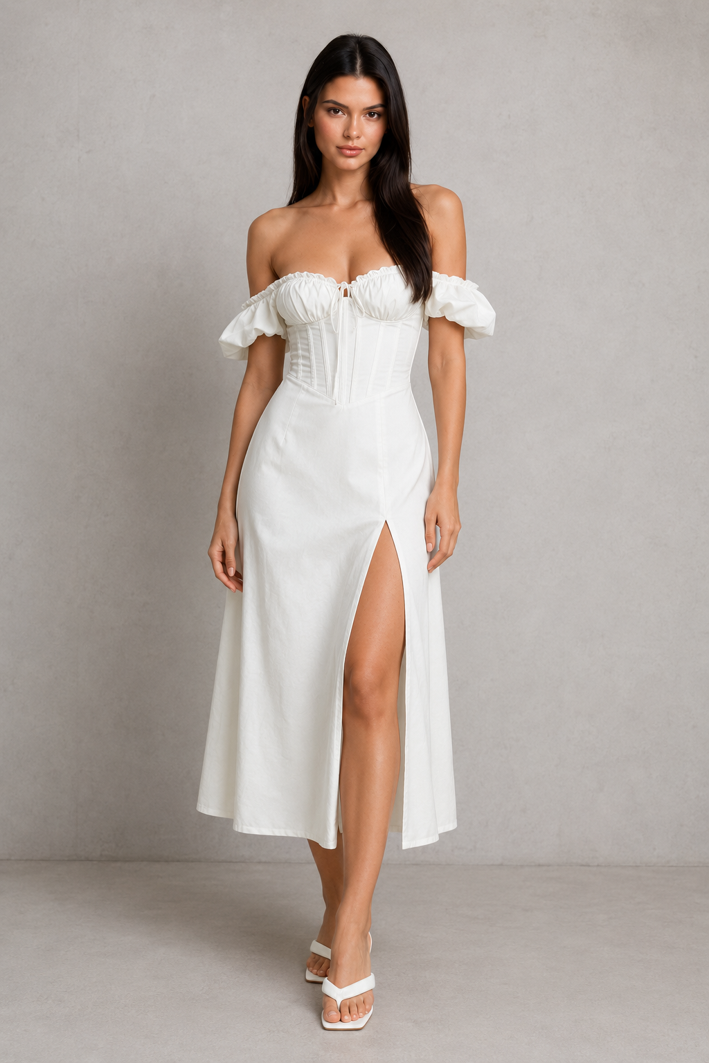 Elegant milkmaid midi dress in a premium cotton blend featuring a structured corset bodice with boning, underwired bust, elasticated puff sleeves, a flowing full skirt, and a thigh-high split. Designed with a shirred lace-up back for a flattering, feminine silhouette perfect for special occasions.