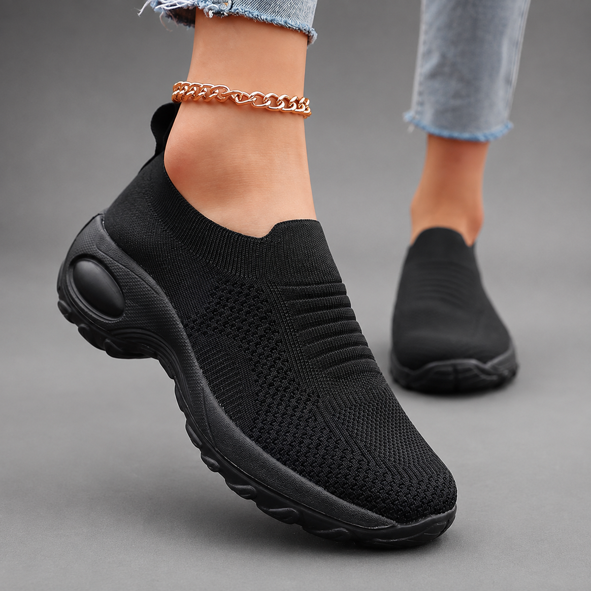 Women’s orthopedic slip-on sneakers with a breathable stretch-knit upper, cushioned footbed and thick lightweight shock-absorbing sole.