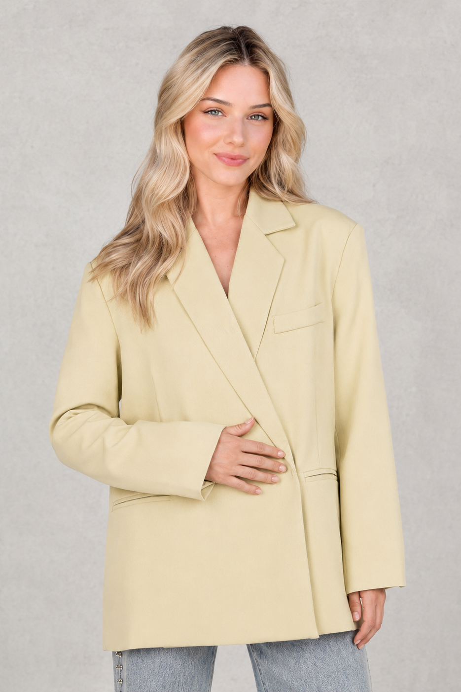 Women’s oversized asymmetrical blazer with a modern button-front closure, structured shoulders, side slits, and a relaxed tailored silhouette.