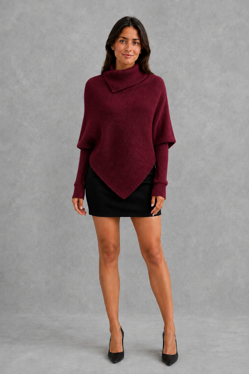 Women’s burgundy oversized batwing sweater with a cozy high neck, long relaxed sleeves, rib-knit texture and modern asymmetrical split hem.