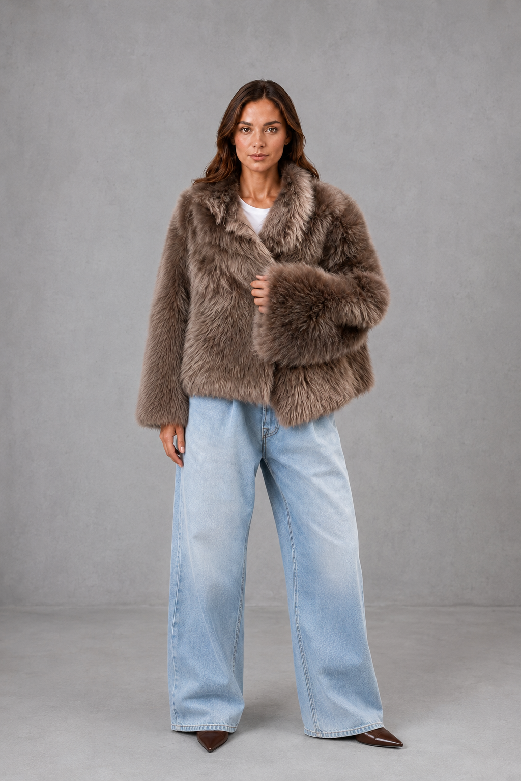 Women’s oversized faux fur coat with a soft plush texture, statement collar and relaxed voluminous silhouette for elegant cold-weather styling.