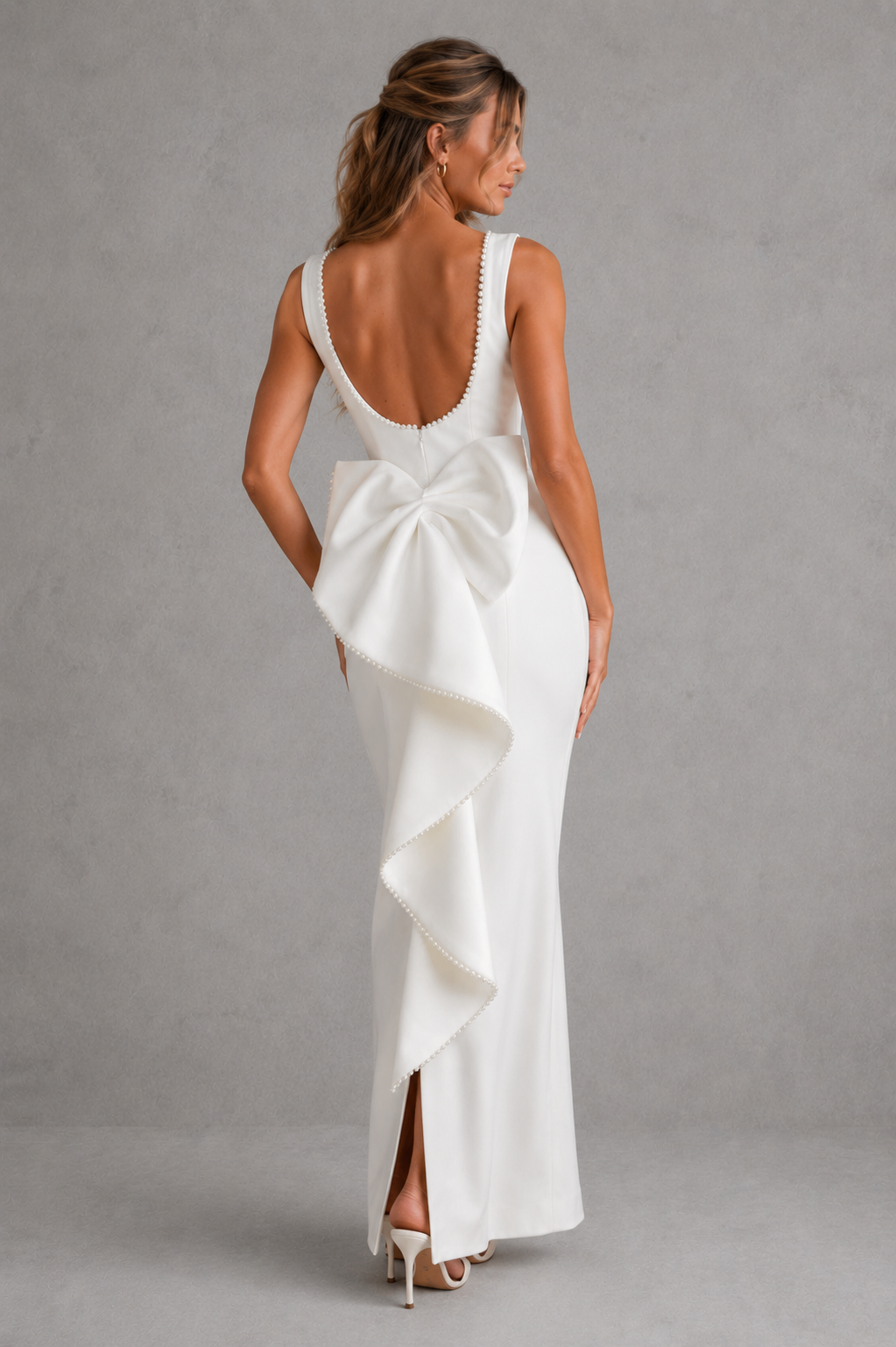 Women's pearl trim midaxi dress in premium non-stretch crepe with a high boat neckline, fitted bodice, sleek column skirt, detachable oversized back bow, pearl embellishments, and centre-back split for evening and formal occasions.