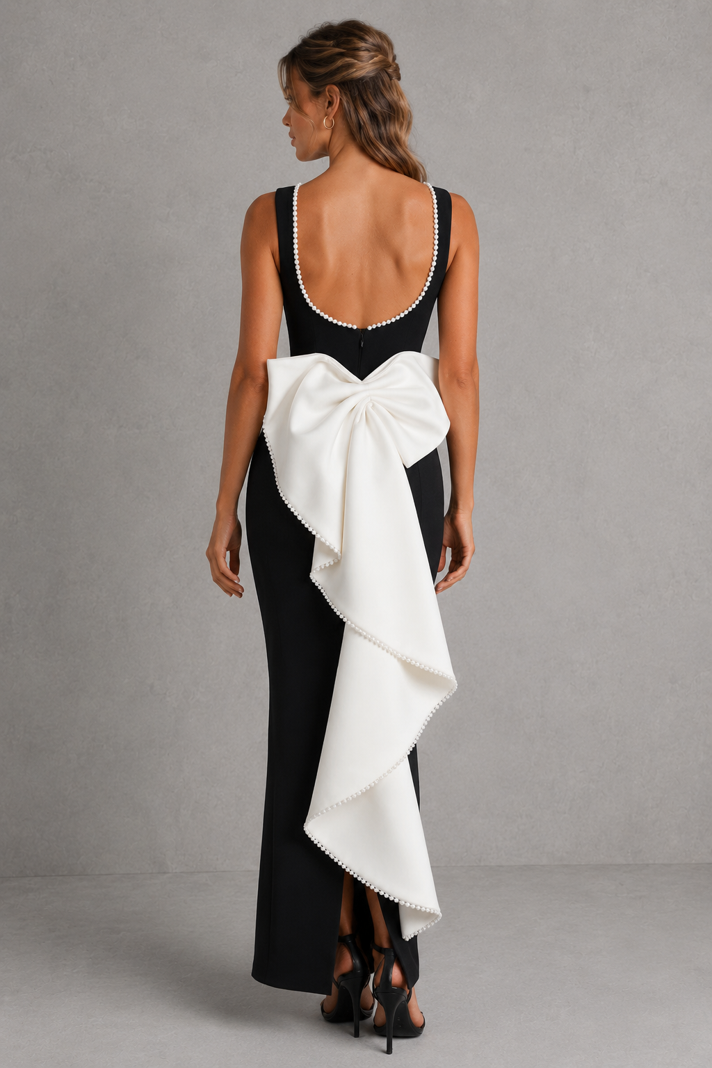 Women's pearl trim midaxi dress in premium non-stretch crepe with a high boat neckline, fitted bodice, sleek column skirt, detachable oversized back bow, pearl embellishments, and centre-back split for evening and formal occasions.