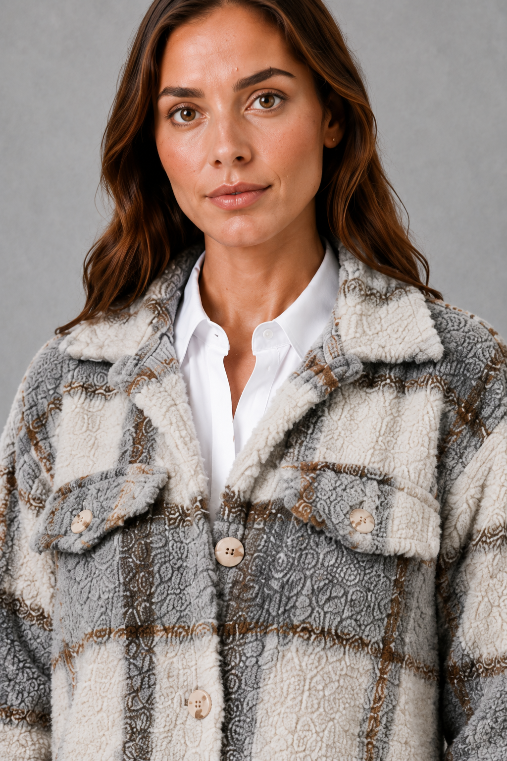 Women’s plaid plush teddy jacket with a soft sherpa-style texture, classic plaid pattern, button-front closure, and relaxed fit for comfortable layering.