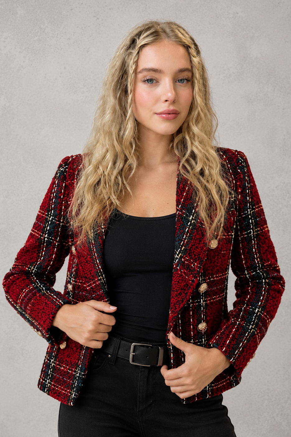 Women’s plaid tweed blazer with a double-breasted front, structured lapel collar, textured woven finish, and tailored silhouette.