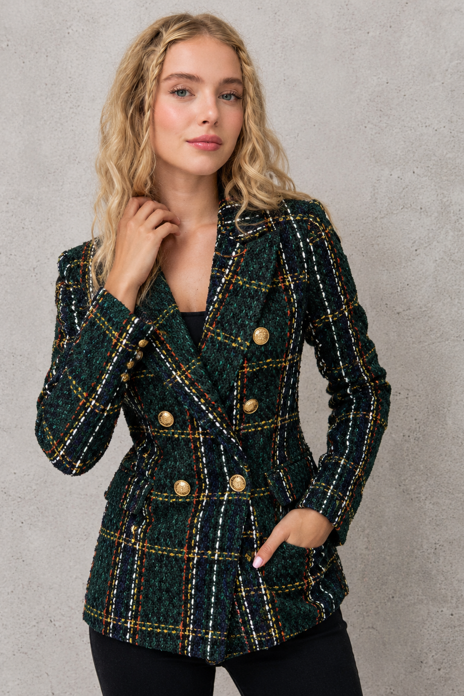 Women’s plaid tweed blazer with a double-breasted front, structured lapel collar, textured woven finish, and tailored silhouette.