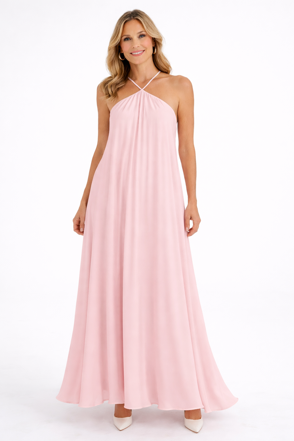 Woman wearing a pink halter neck dress on a white background