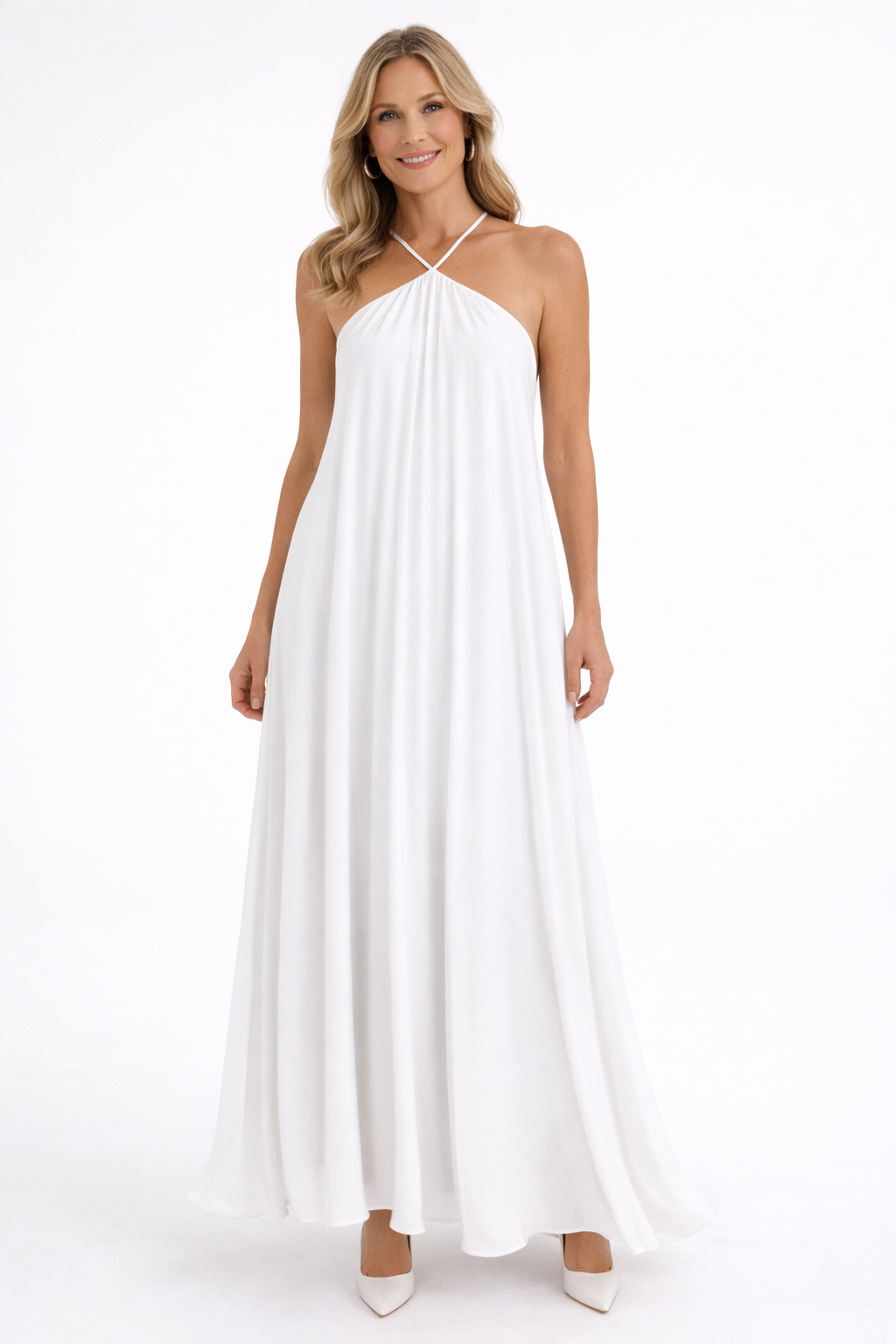 Woman wearing a white halter neck dress on a white background