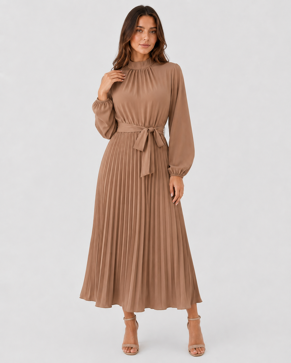 Womenโs long-sleeve pleated midi dress featuring a high gathered neckline, fabric waist belt, and flowing pleated skirt. Designed with a fitted waist and relaxed silhouette for comfortable everyday wear.