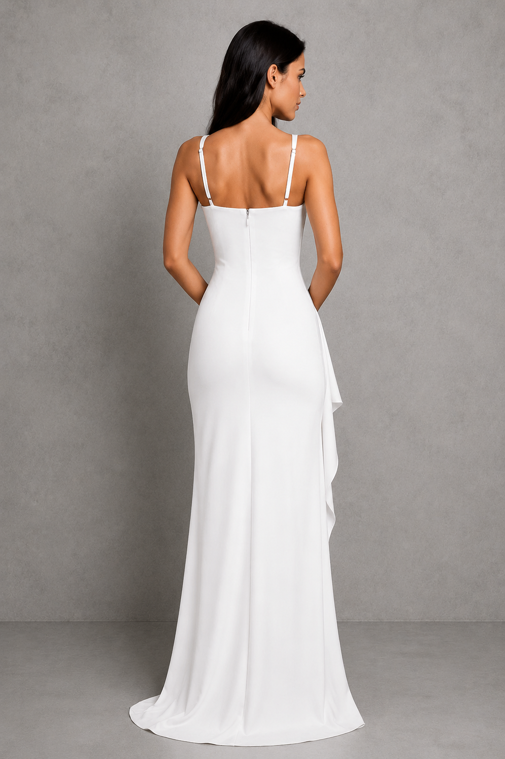 Woman wearing an elegant plunge neck maxi dress in premium stretch crepe, featuring asymmetric pleated detailing, adjustable straps, a fitted silhouette, and a draped thigh-high split. The flowing maxi-length skirt creates graceful movement, making it ideal for evening events, formal occasions, and special celebrations.