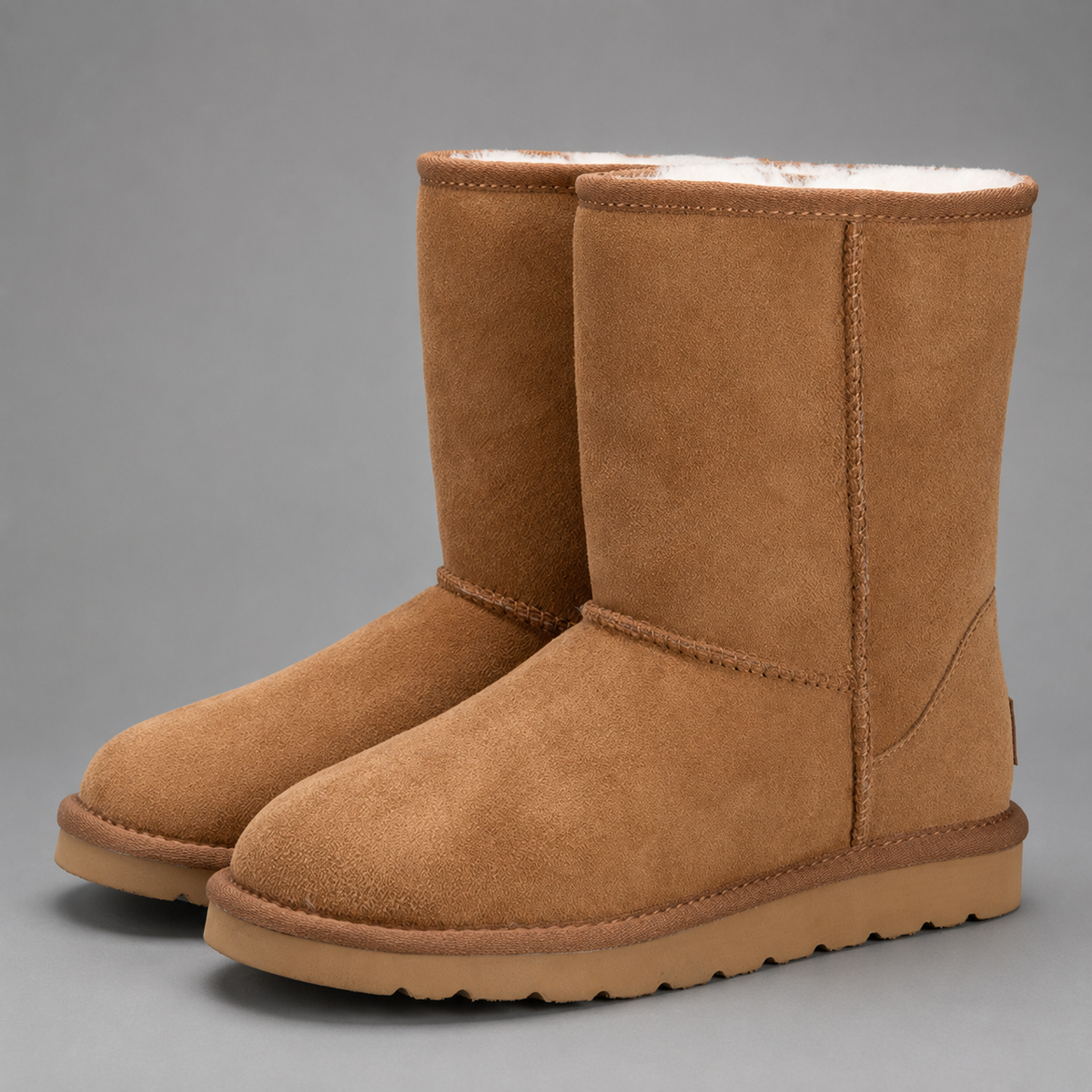 Women’s plush-lined mid-calf snow boots with a soft cotton upper, corduroy shaft, cozy interior, round toe and easy slip-on design.