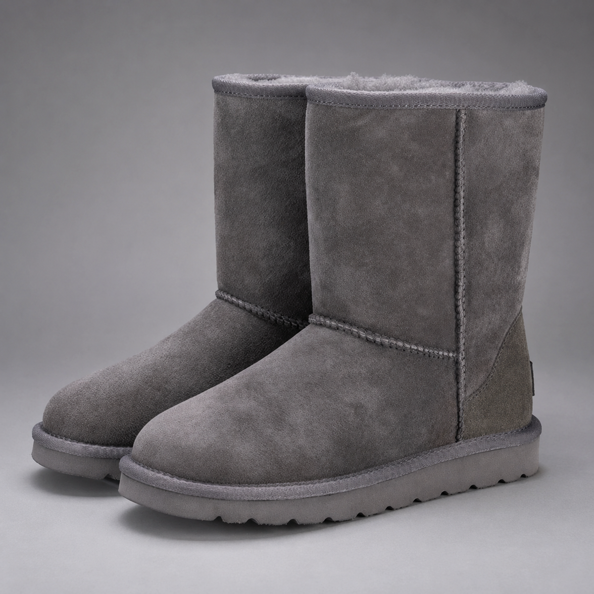 Women’s plush-lined mid-calf snow boots with a soft cotton upper, corduroy shaft, cozy interior, round toe and easy slip-on design.