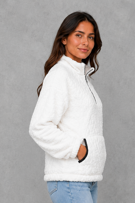 Women’s plush half-zip fleece pullover with a high stand neckline, soft fleece texture, two front pockets, long sleeves, and elasticized cuffs.
