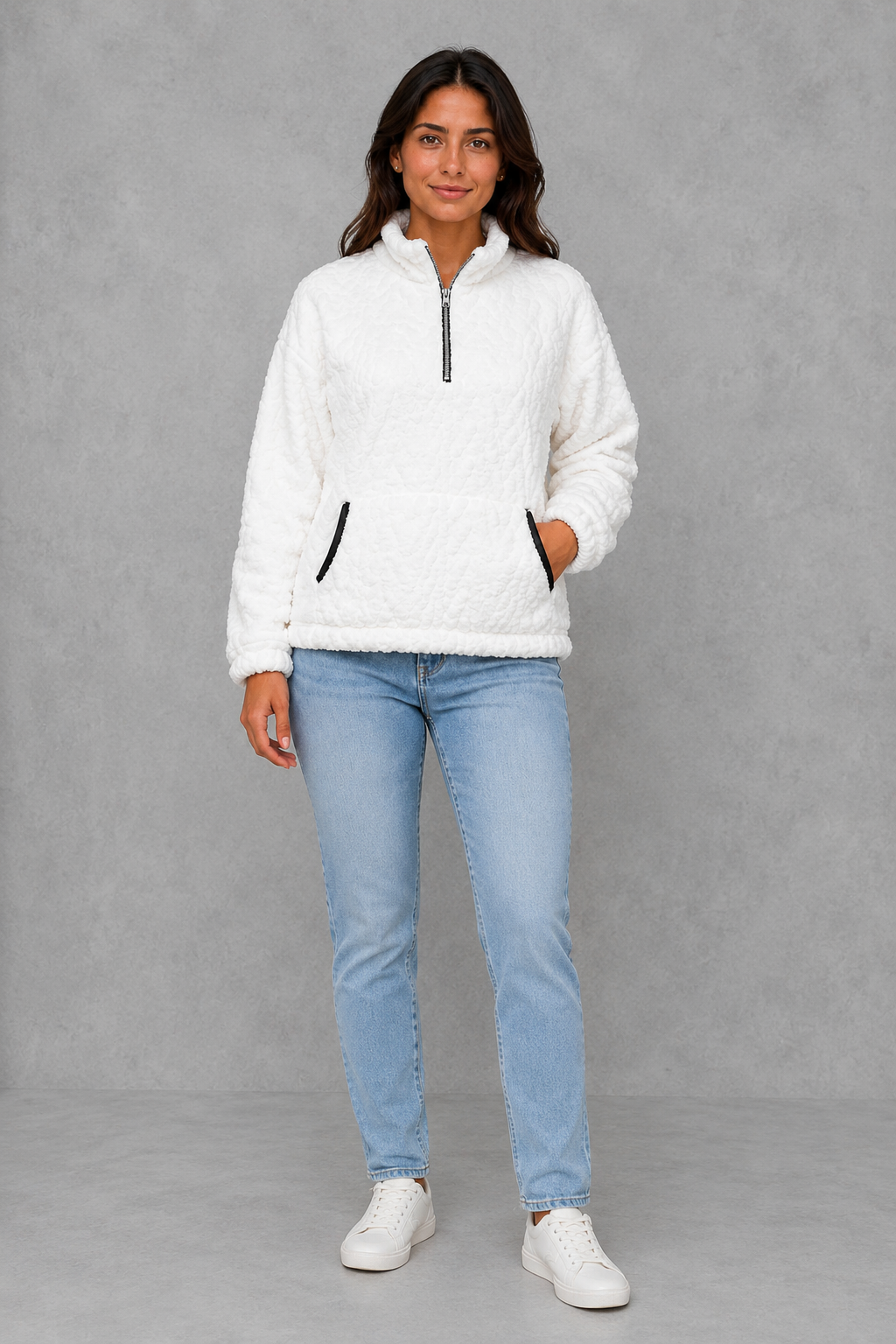 Women’s plush half-zip fleece pullover with a high stand neckline, soft fleece texture, two front pockets, long sleeves, and elasticized cuffs.