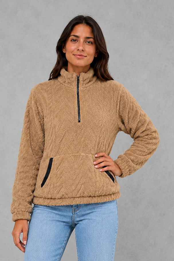 Women’s plush half-zip fleece pullover with a high stand neckline, soft fleece texture, two front pockets, long sleeves, and elasticized cuffs.