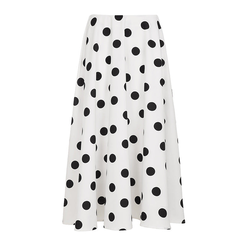 Womenโs flowy maxi skirt featuring a classic black-and-white polka dot pattern, lightweight breathable fabric, and a relaxed silhouette for comfortable everyday wear.