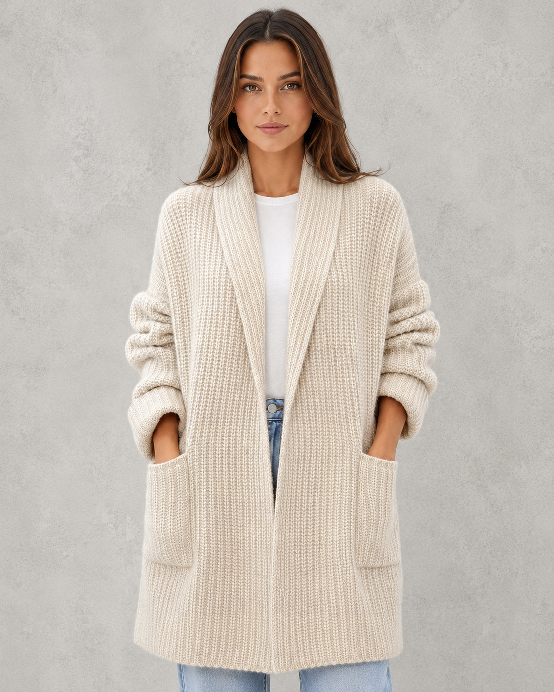 Woman wearing a relaxed fit moonlit knit cardigan with a soft draped silhouette, lightweight texture, and elegant layering appeal for autumn styling.
