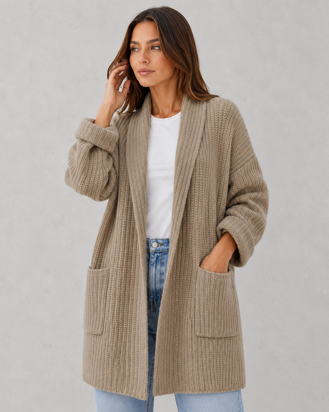 Woman wearing a relaxed fit moonlit knit cardigan with a soft draped silhouette, lightweight texture, and elegant layering appeal for autumn styling.