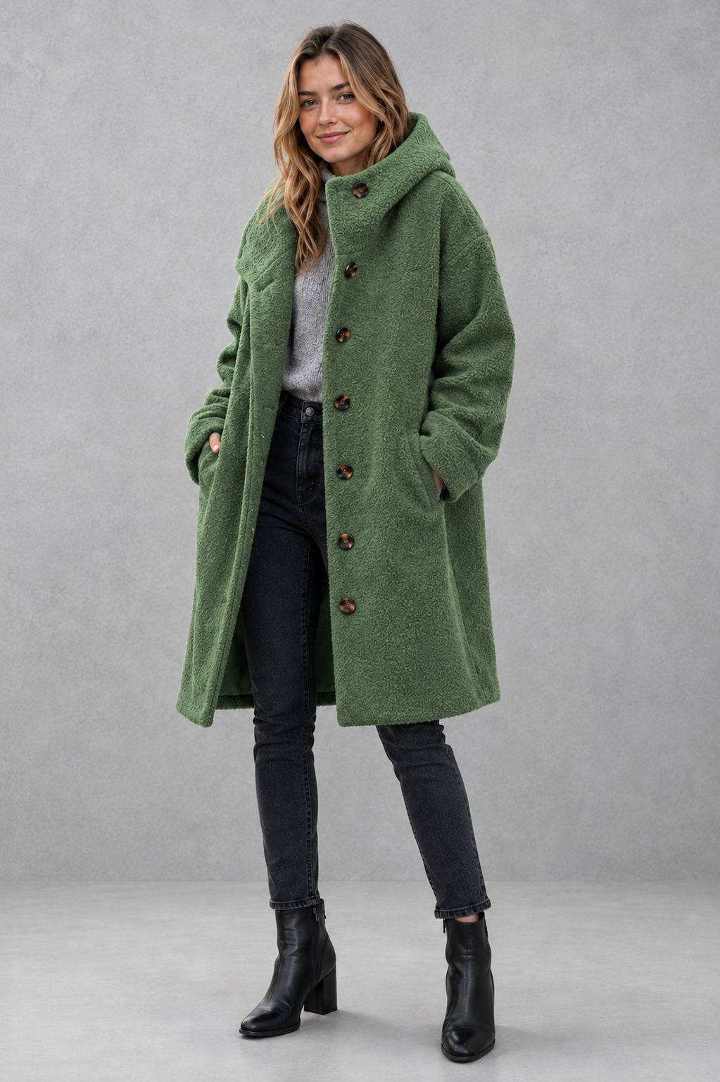 Women’s relaxed fit button coat with a classic overcoat silhouette, long sleeves, lightweight construction, and elegant button-front closure.