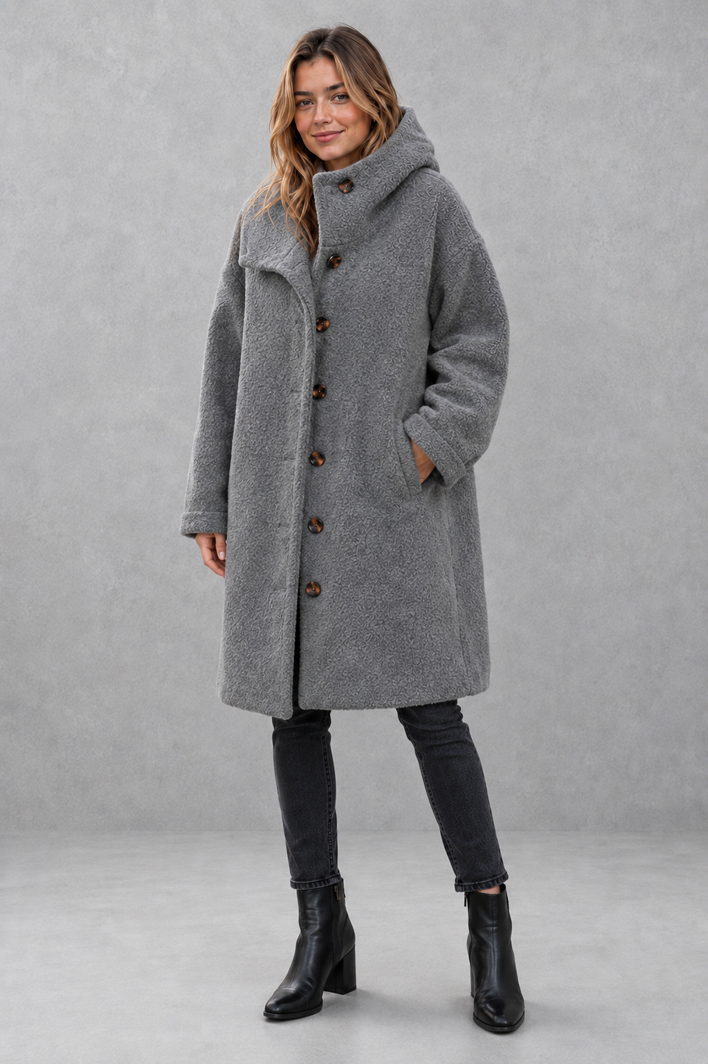 Women’s relaxed fit button coat with a classic overcoat silhouette, long sleeves, lightweight construction, and elegant button-front closure.