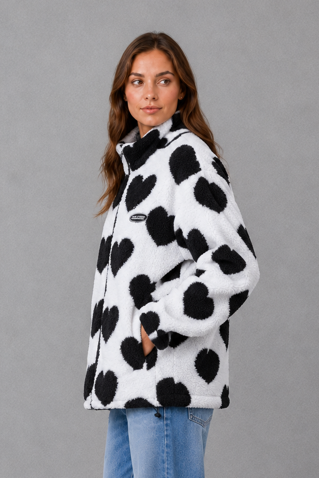 Women’s reversible heart print jacket with a lightweight soft-touch construction, feminine silhouette and versatile 2-in-1 design.