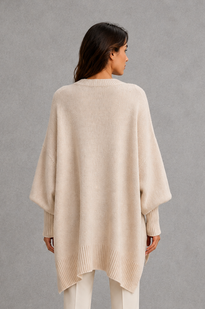Women’s ribbed mock neck sweater with long sleeves, a relaxed softly draped silhouette and classic solid-color knitted design.