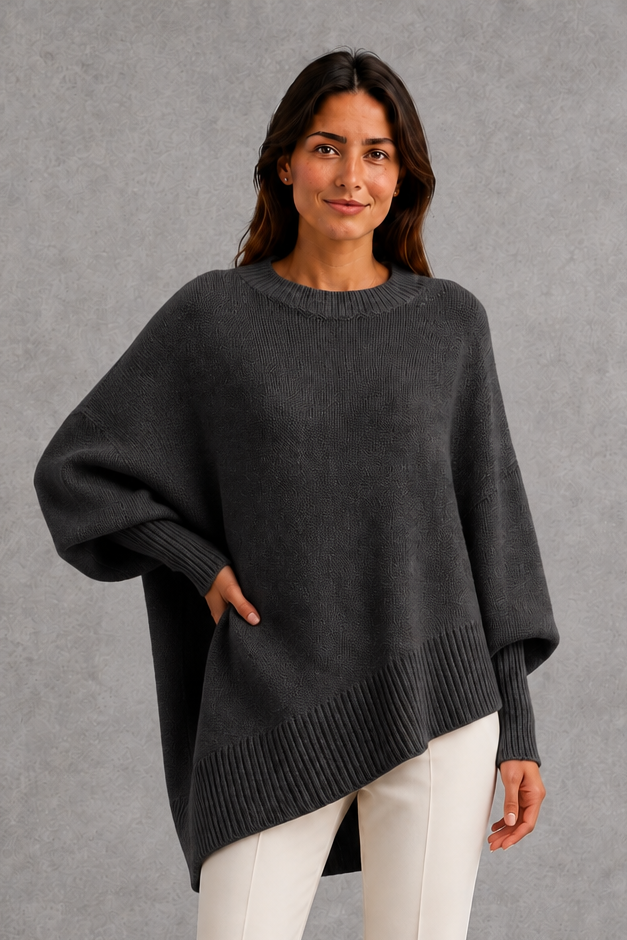 Women’s ribbed mock neck sweater with long sleeves, a relaxed softly draped silhouette and classic solid-color knitted design.