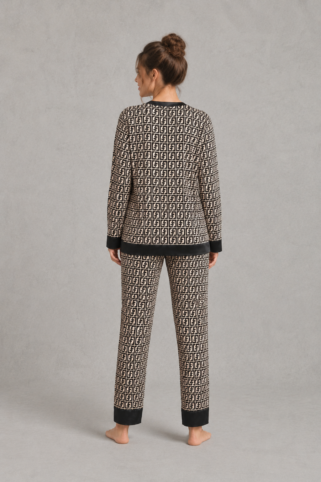 Women’s satin 2-piece pajama set with a geometric print, long-sleeve button-up V-neck top, and matching full-length pajama pants.