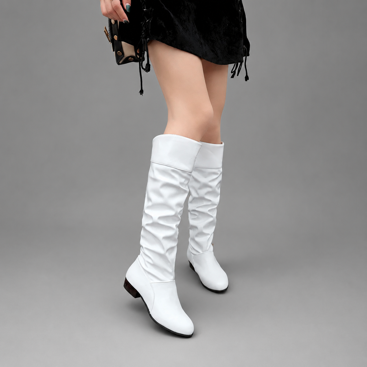Women’s slouch knee-high boots with a smooth PU leather-look finish, relaxed shaft, low block heel, and durable rubber outsole.