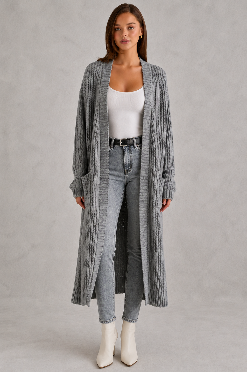 Woman wearing a relaxed-fit V-neck button cardigan sweater with a soft knit texture, styled for elegant autumn and winter layering.