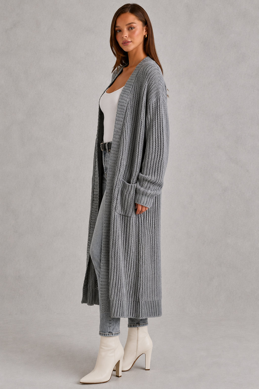Woman wearing a relaxed-fit V-neck button cardigan sweater with a soft knit texture, styled for elegant autumn and winter layering.