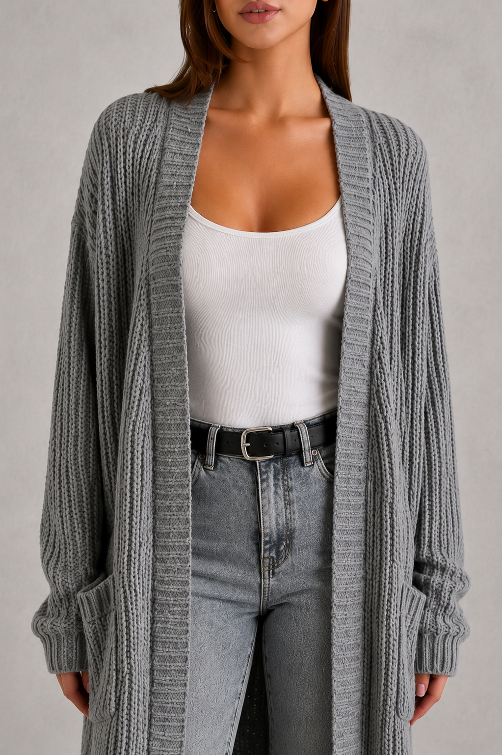 Woman wearing a relaxed-fit V-neck button cardigan sweater with a soft knit texture, styled for elegant autumn and winter layering.