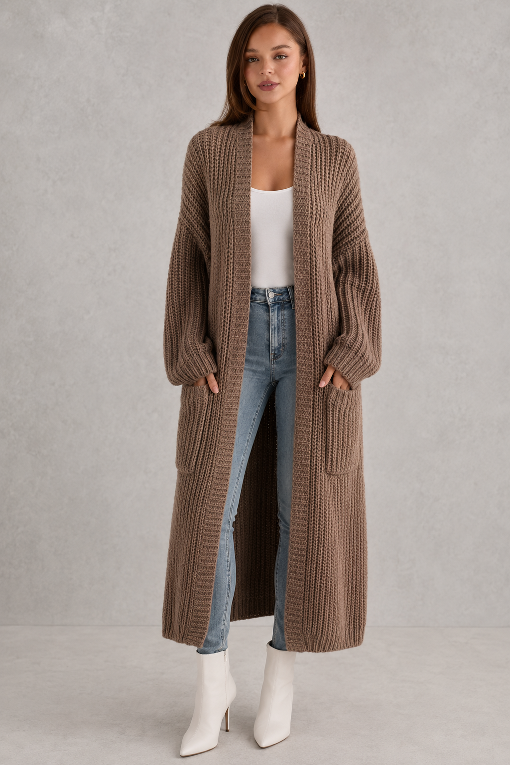 Woman wearing a relaxed-fit V-neck button cardigan sweater with a soft knit texture, styled for elegant autumn and winter layering.