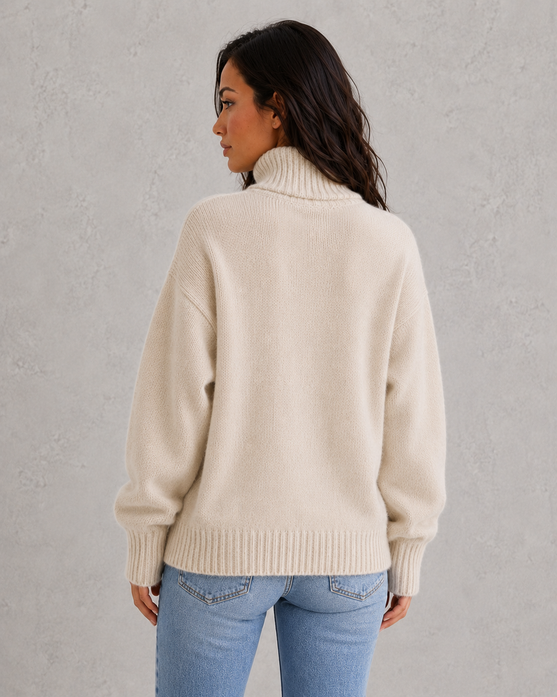 Women's soft cashmere turtleneck sweater with relaxed fit and elegant cold-weather styling.