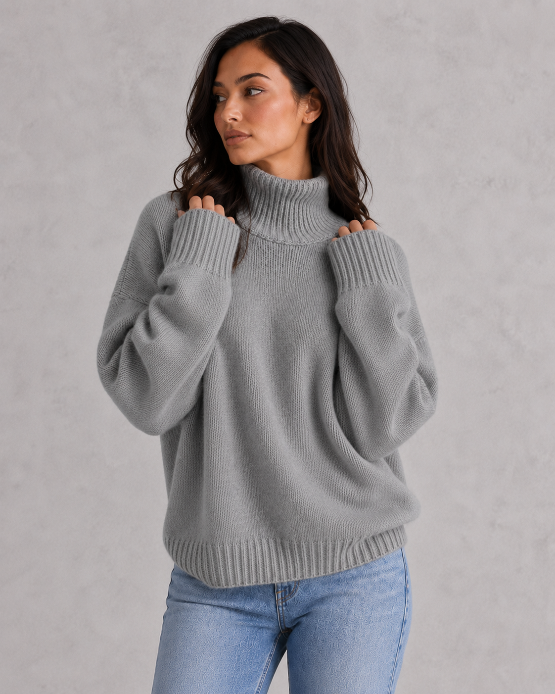 Women's soft cashmere turtleneck sweater with relaxed fit and elegant cold-weather styling.