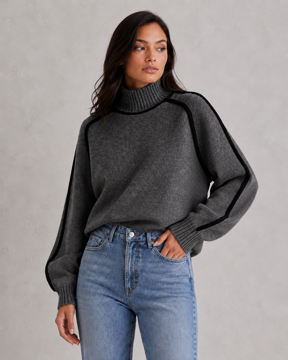 Woman wearing a soft merino wool turtleneck sweater with a relaxed fit and elegant winter styling.