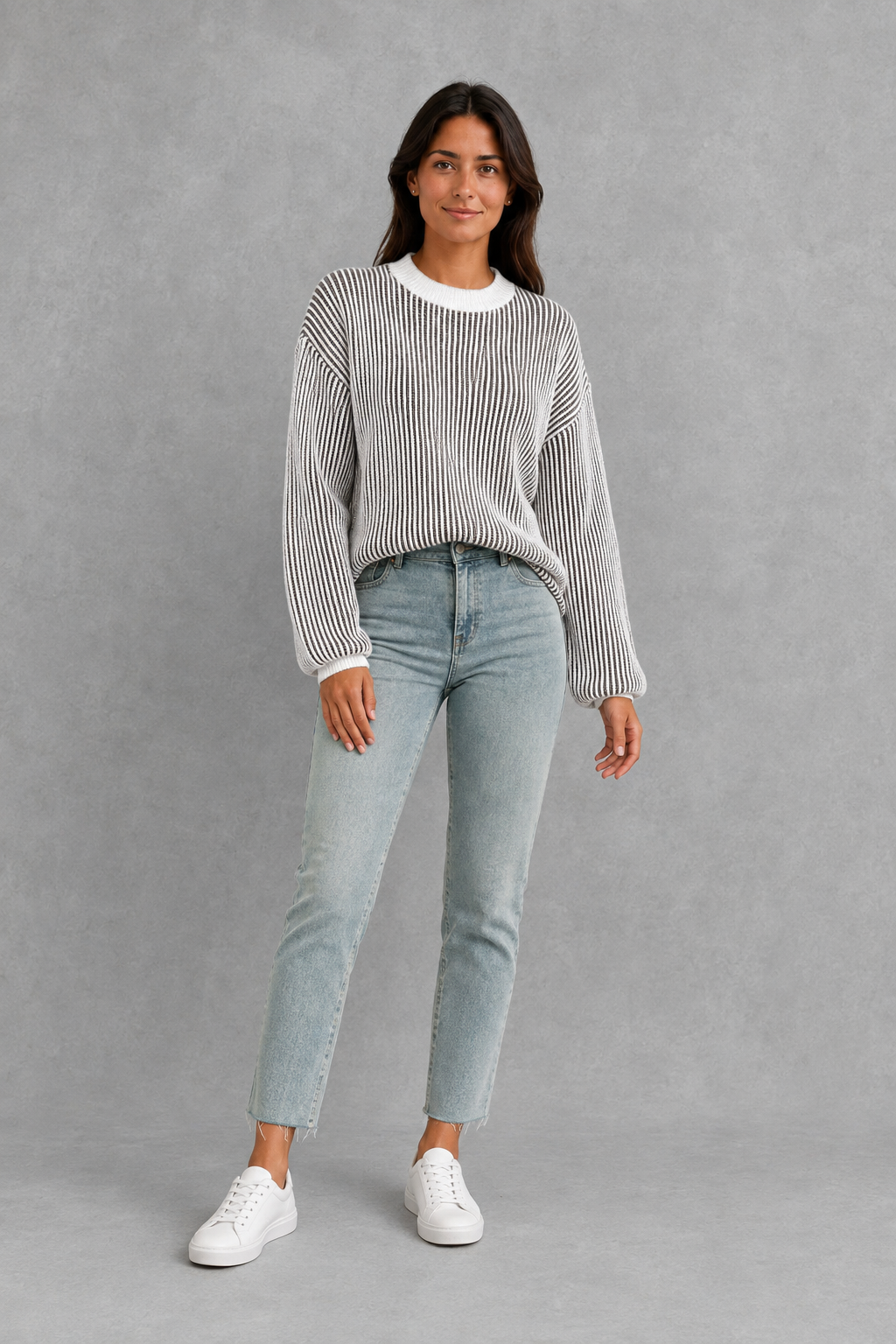 Women’s gray striped crew neck sweater with long sleeves, relaxed dropped shoulders and a cozy thick-knit silhouette for everyday wear.