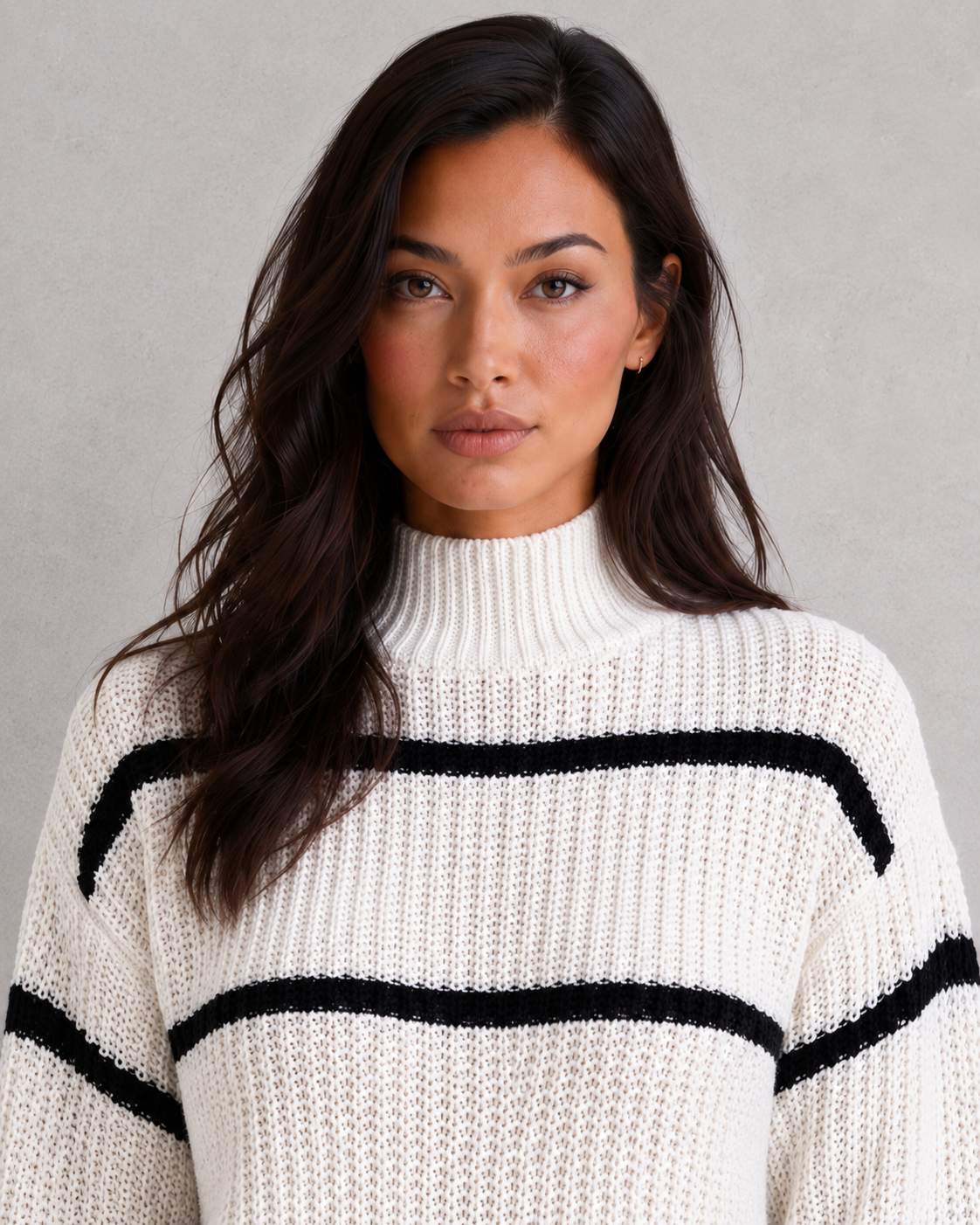 Women's striped knit turtleneck sweater with relaxed fit, lantern sleeves, and mock neck in a timeless autumn-winter design.