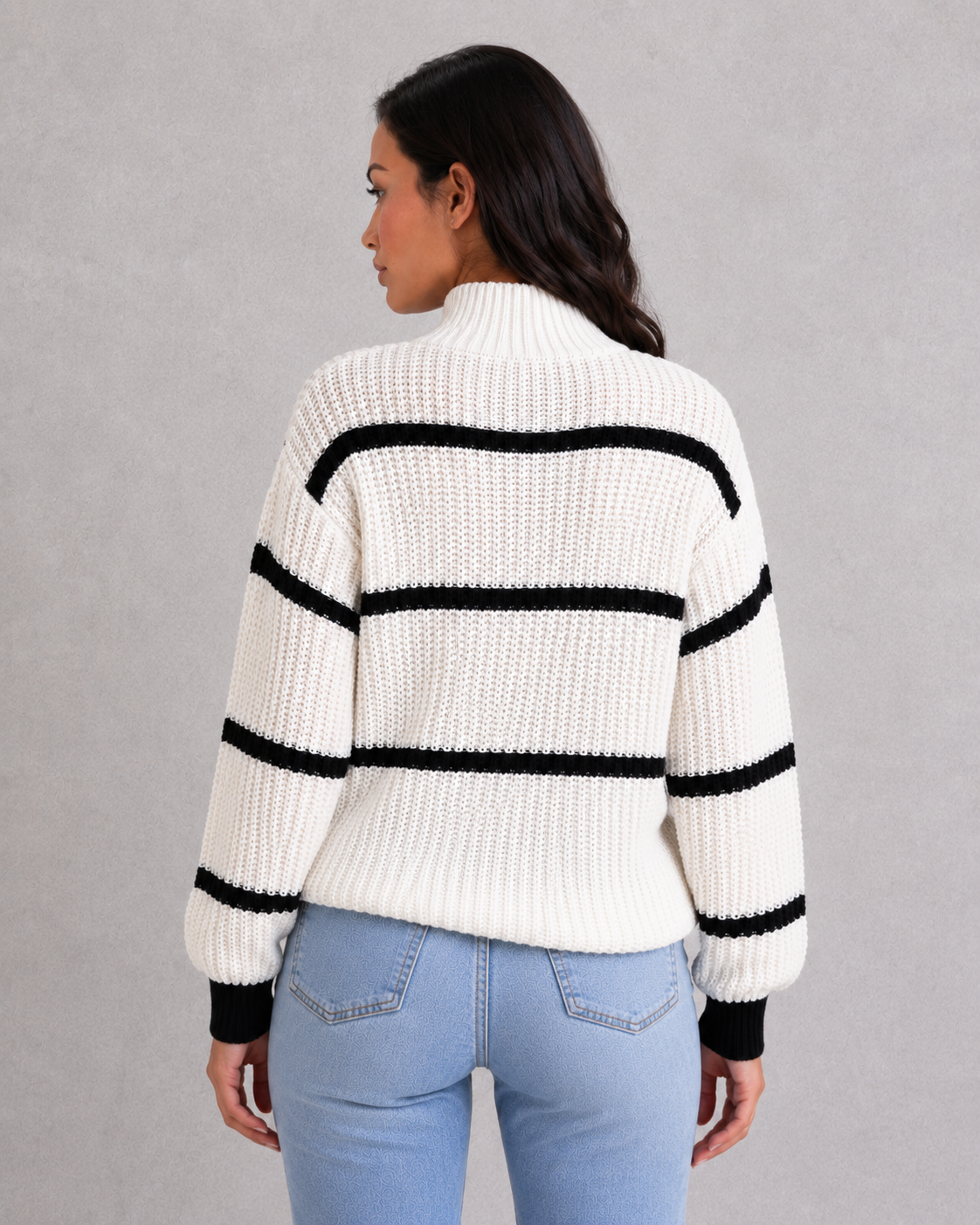 Women's striped knit turtleneck sweater with relaxed fit, lantern sleeves, and mock neck in a timeless autumn-winter design.