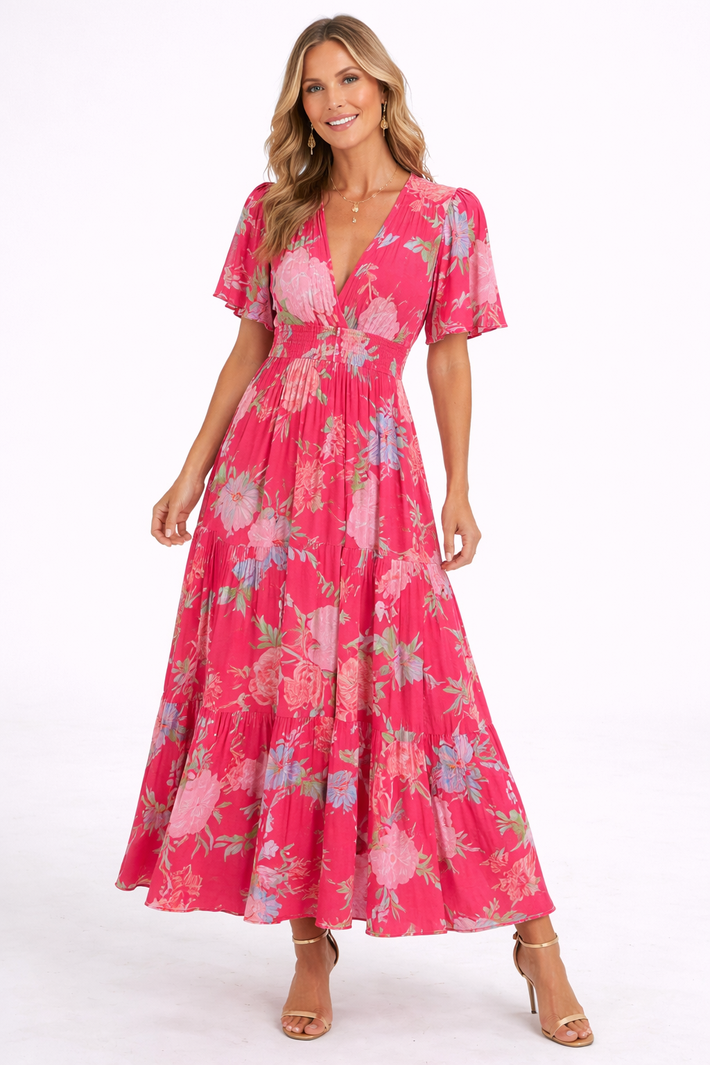 Woman wearing a pink floral dress on a white background