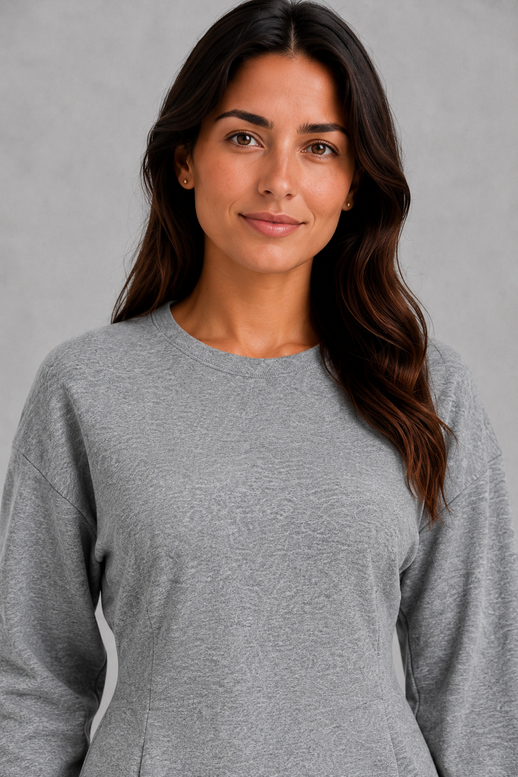 Women’s two-piece lounge set featuring a softly fitted long-sleeve crew neck top with a shaped waist and matching wide-leg pants with side pockets.