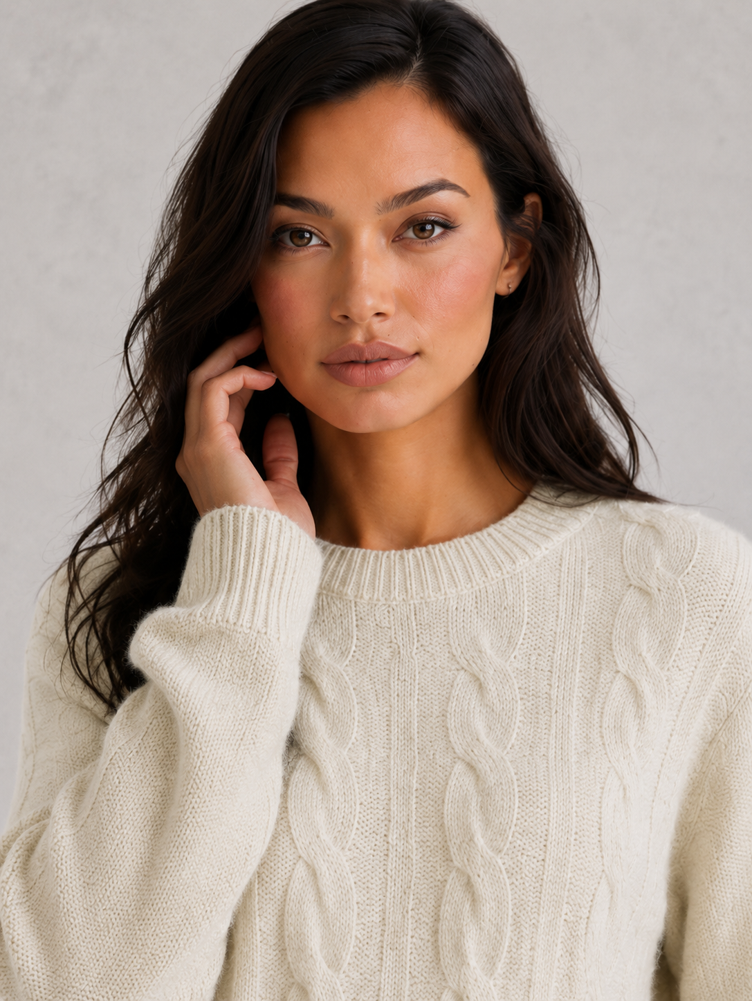 Woman wearing an ultra-soft knitted jumper with a relaxed fit, cozy texture, and modern silhouette styled for effortless everyday elegance.