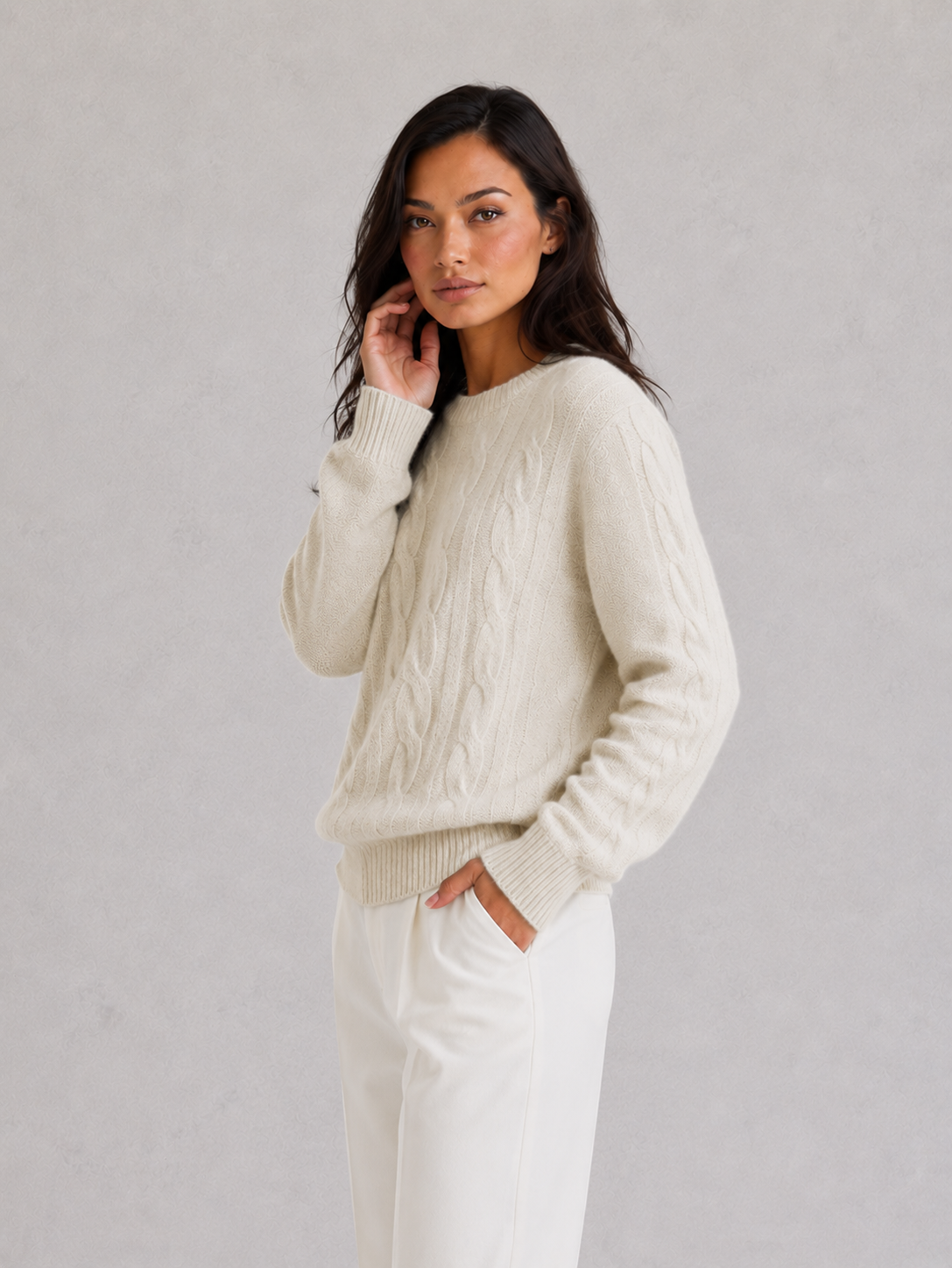 Woman wearing an ultra-soft knitted jumper with a relaxed fit, cozy texture, and modern silhouette styled for effortless everyday elegance.
