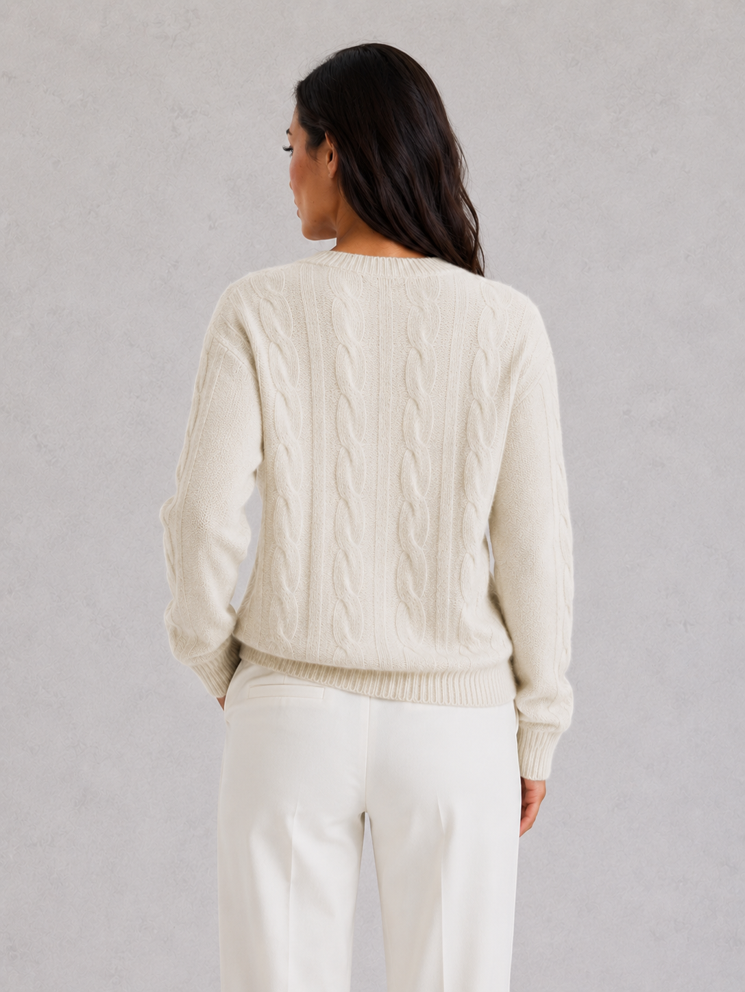 Woman wearing an ultra-soft knitted jumper with a relaxed fit, cozy texture, and modern silhouette styled for effortless everyday elegance.